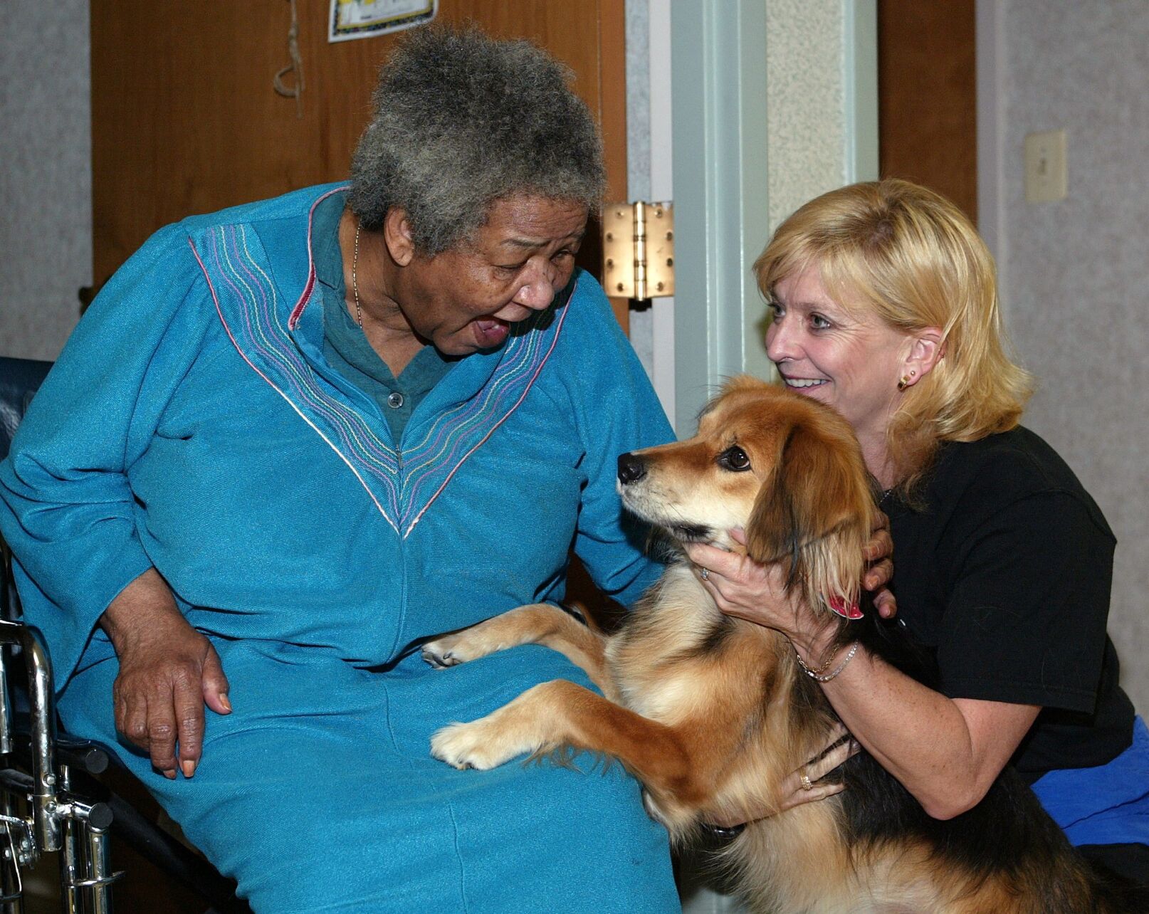 FPOW volunteer with dog and resident.jpg